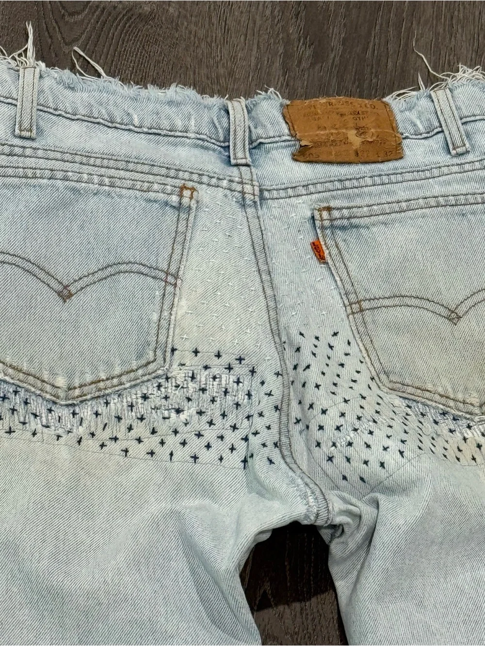 Vintage orange tab Y2K Light Blue Distressed Men’s Jeans with Patch Detail